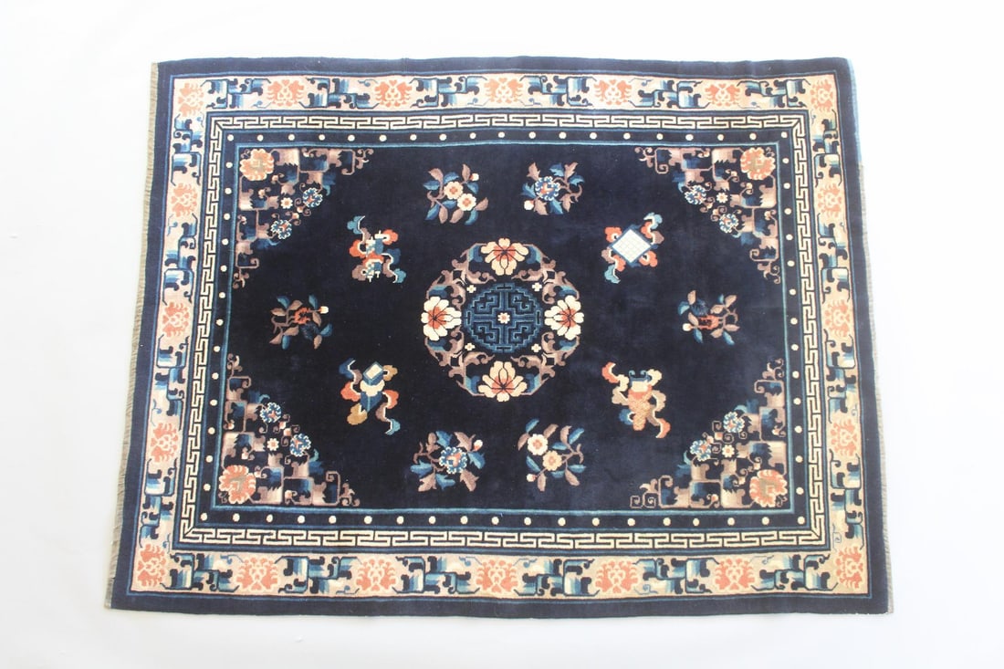Chinese Art Deco Rug, Deep Blue Wool: Chinese Deep Blue Art Deco Rug. Wool rug, with floral decorations and symbols of learning and knowledge including scrolls, a book and a game board n contrasting orange, tan and light blue. The ends ar