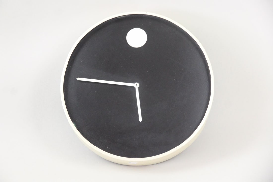 Nathan George Horwitt for Howard Miller MOMA Museum Wall Clock: MOMA Museum Wall Clock, Nathan George Horwitt for Howard Miller, 1970. Minimalist silver & black clock made of metal and glass. Label on back reads: "Howard Miller / Museum Wall Clock / designed by