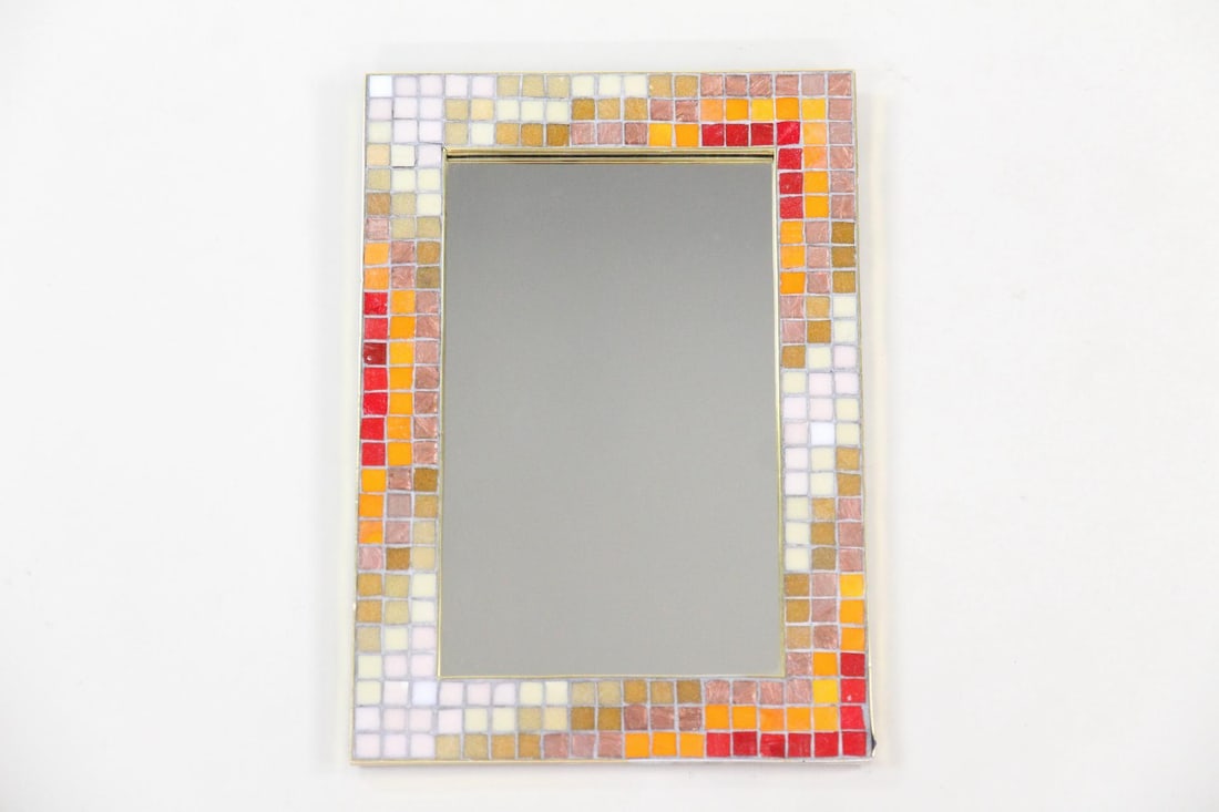 Belgian Knitter Duro Mosaic Mirror: Mid-century Modern Knitter Duro Mosaic Tile Mirror. Mirror with hand cut mosaic tiles patterned frame in warm, cheerful hues. Marked Made in Belgium to the back with Knitter company labels attached.