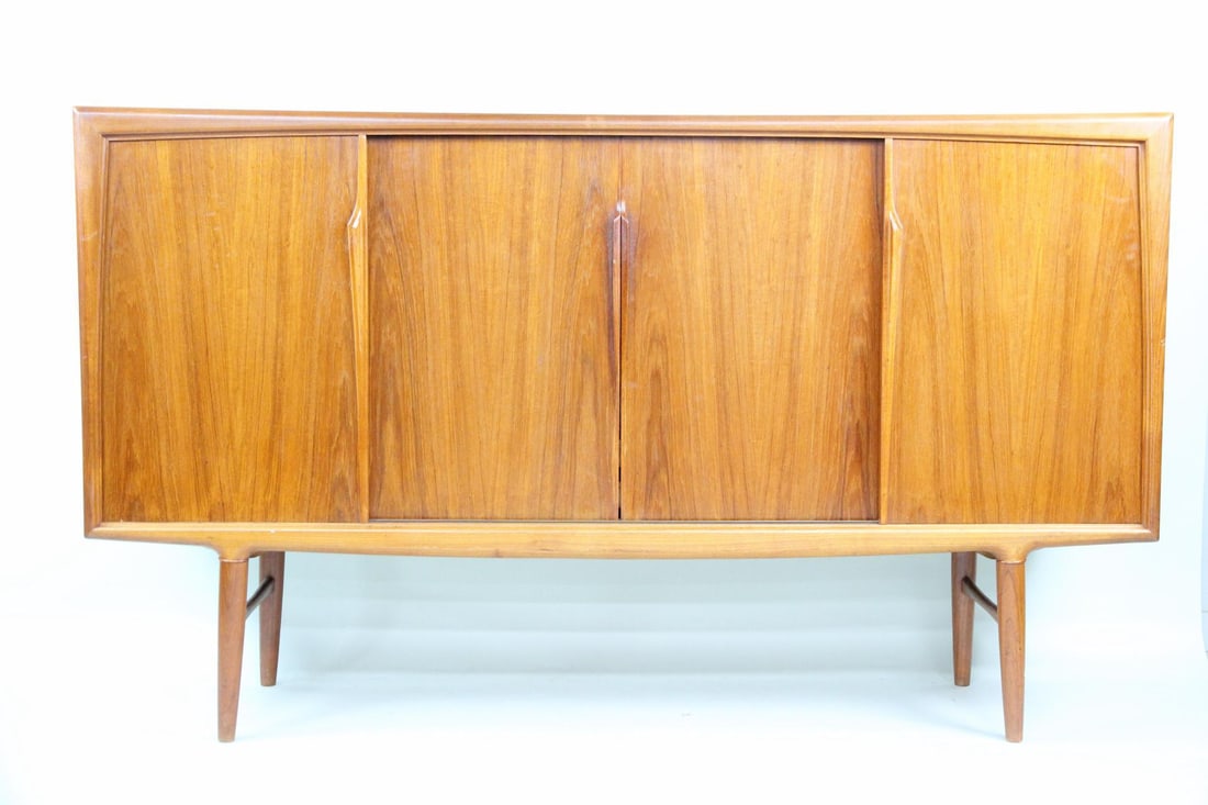 Teak Highboy Sideboard Bar Cabinet, Gunni Omann: Danish Mid-Century Modern Teak High Sideboard Highboy Bar Cabinet, Gunni Omann. Sculptural cabinet with frosted glass bar inside, as well as 4 green felt lined drawers and shelves. Designed by Gunni