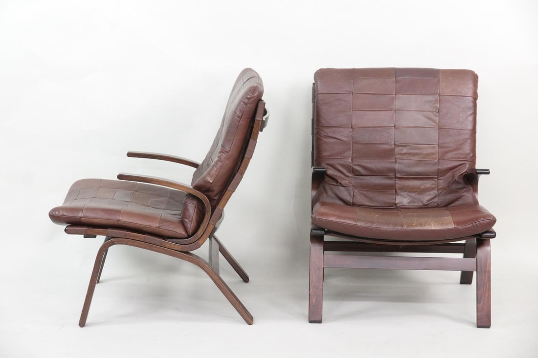 Pair of Rosewood & Leather Farstrup Lounge Chairs: Pair of Mid-century Modern Bentwood Leather Chairs, Farstrup Mobler. A pair of lounge chairs with elegant bent rosewood frames and brown patchwork leather cushions. In the style of Farstrup Mobler.