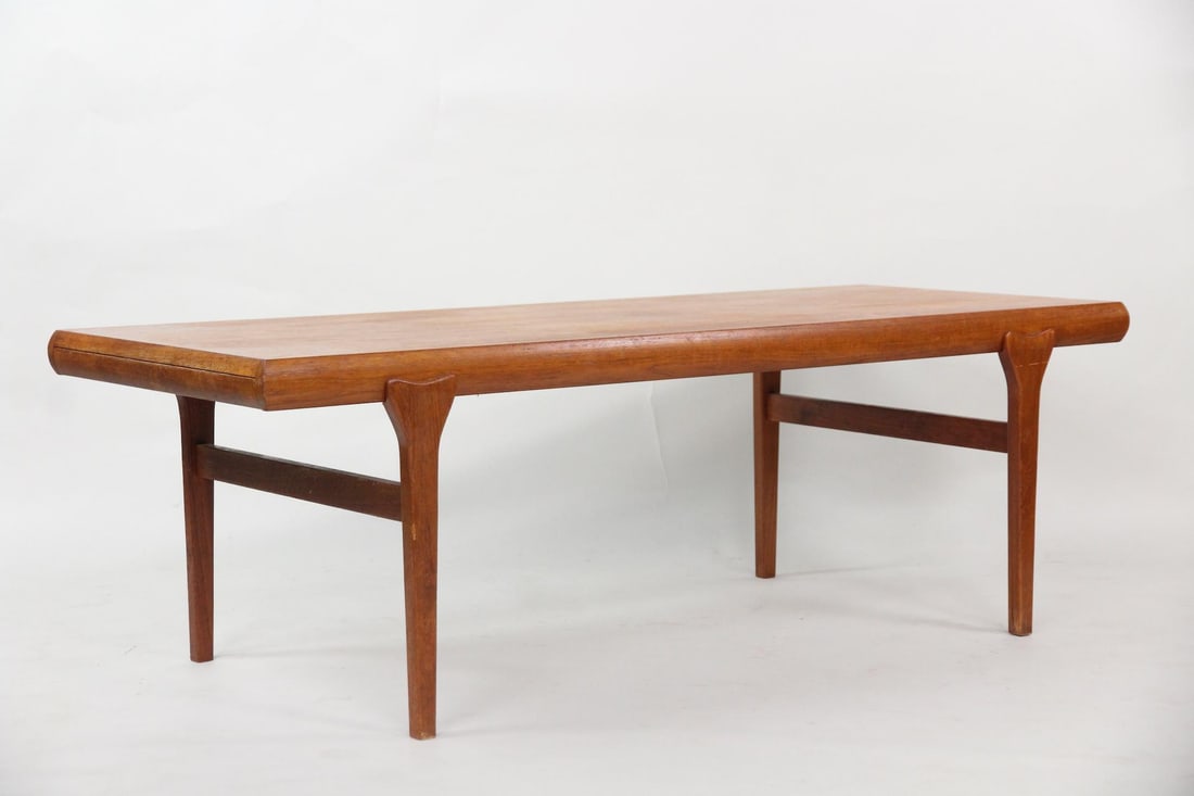 Expandable Teak Coffee Table, Johannes Andersen: Expandable Teak Coffee Table, Johannes Andersen. Low table with a pull-out drawer and table on either end, made of warm teak wood. Unmarked, this is by Johannes Andersen. Dimensions are 20.5 in h x