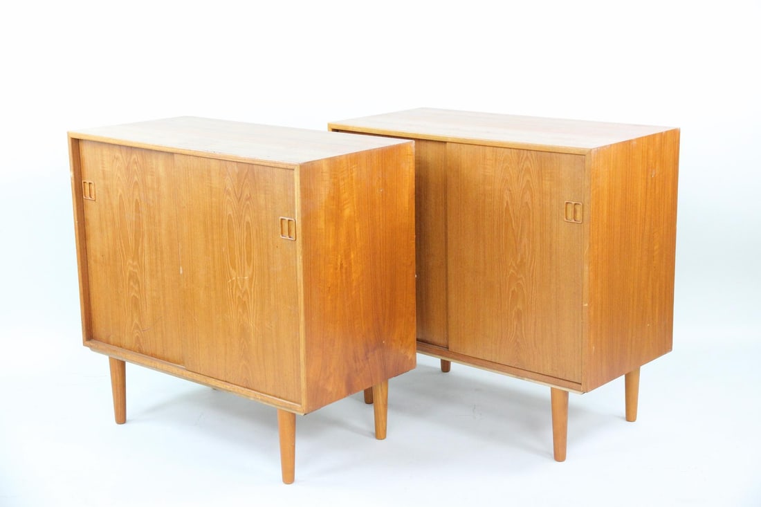 Pair of Mobelfabrik Horsesns Teak Cabinets, Drybars: Near Pair of Danish Modern Teak Cabinets, Drybars. Near pair of two-door cabinets, featuring mirrored shelving to the interior and tapered legs. Labeled Mobelfabrik Horsens, Denmark to the back.