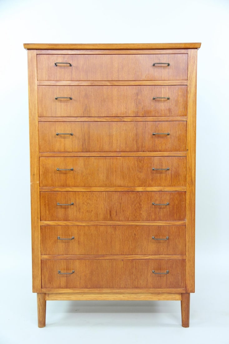 Danish Teak Tallboy Dresser, Brass Pulls: Danish Mid-century Modern Teak Tallboy Chest of Drawers, Brass Pulls. Tall dresser with seven drawers, made of light teak wood and featuring brass wire handles. Dimensions are 48.5 in h x 29 in w x