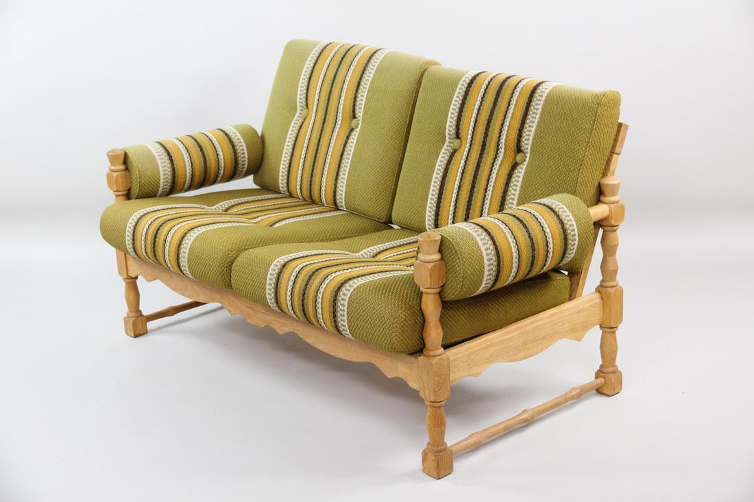 Oak Upholstered Loveseat, Henning Kjaernulf: Danish Oak Loveseat, Henning Kjærnulf. A two-seater sofa or loveseat, believed to be by Henning Kjærnulf. Featuring upholstered arms and a carved frame with green, brown, yellow and white striped