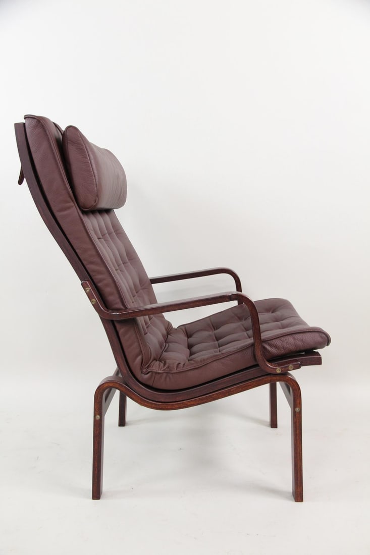 Dark Brown Leather & Bentwood Lounge Chair, Gustav Axel Berg: Danish Modern Dark Brown Leather & Bentwood Lounge Chair in the style of Gustav Axel Berg. Nice chair with dark brown button-tufted leather upholstery, a padded headrest and a bentwood frame. Dimensio