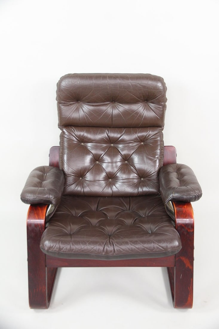 Cantilevered Tufted Leather Lounge Chair: Danish Mid-Century Modern Bentwood & Tufted Leather Lounge Chair. Cantilever chair with dark reddish brown bentwood frame, upholstered in dark brown leather. Dimensions are 34.5 in h x 34 in w x 31 in