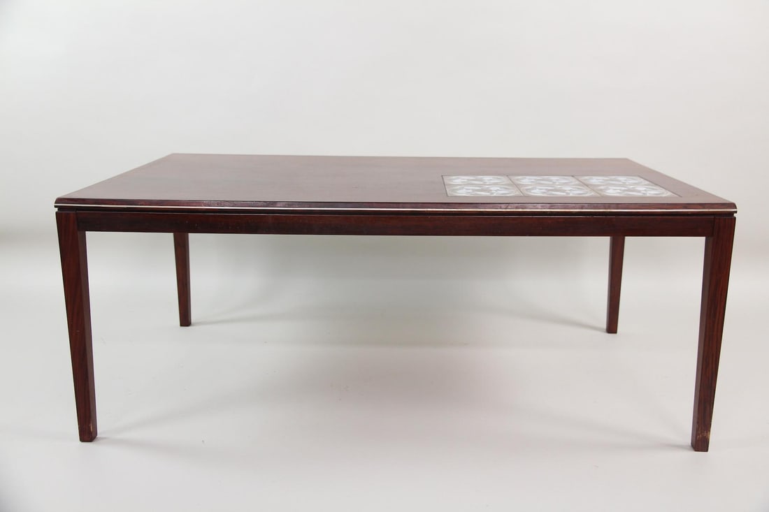 Rosewood Coffee Table with Tile Insert: Danish Modern Rosewood Coffee Table with Tile Insert, similar to Johannes Anderson. Nice rosewood coffee table with tapered legs and one corner inset with ceramic tiles in a paisley or whale motif.