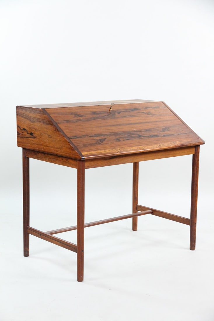 Torbjorn Afdal Slant Front Rosewood Desk: Danish Modern Torbjorn Afdal Rosewood Desk. Beautiful desk in rosewood with dropdown writing surface and 2 drawers inside. Designed by Torbjørn Afdal with no marks. Dimensions are 35.5 in h x 37 in