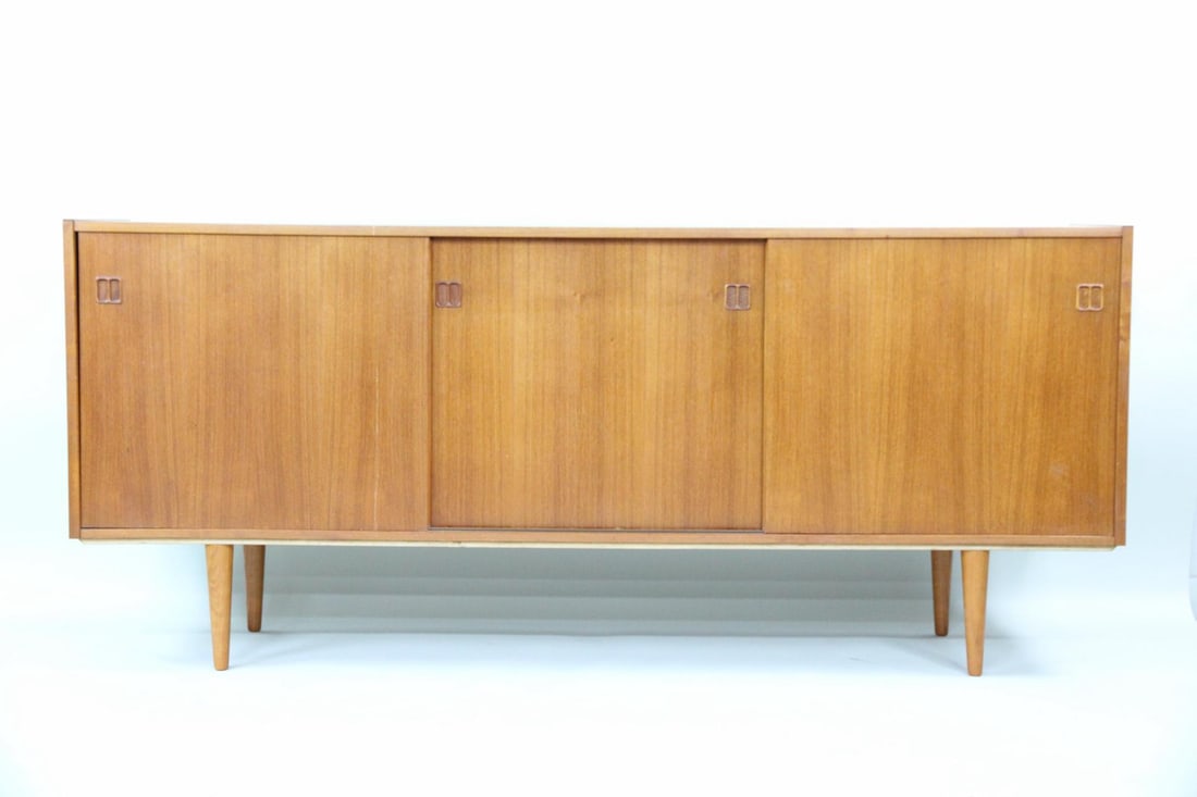 Teak Credenza with Sliding Doors: Danish Mid-Century Modern Teak Credenza with Sliding Doors, Sideboard. Credenza in teak, with clean lines and sculpted pulls. Four interior drawers and 2 cabinets provide lots of storage. Dimensions