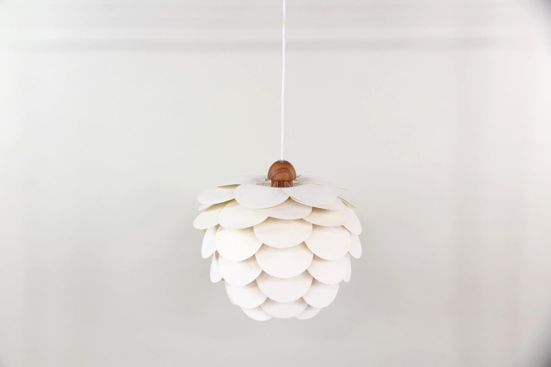 Danish Pinecone Hanging Lamp, Teak & Plastic: Danish Mid-century Modern Pinecone Hanging Lamp, Teak & Plastic. A hanging light with a pinecone form, made of white plastic discs attached to a teak center. Dimensions are 15.5 in h x 17 in w x 17