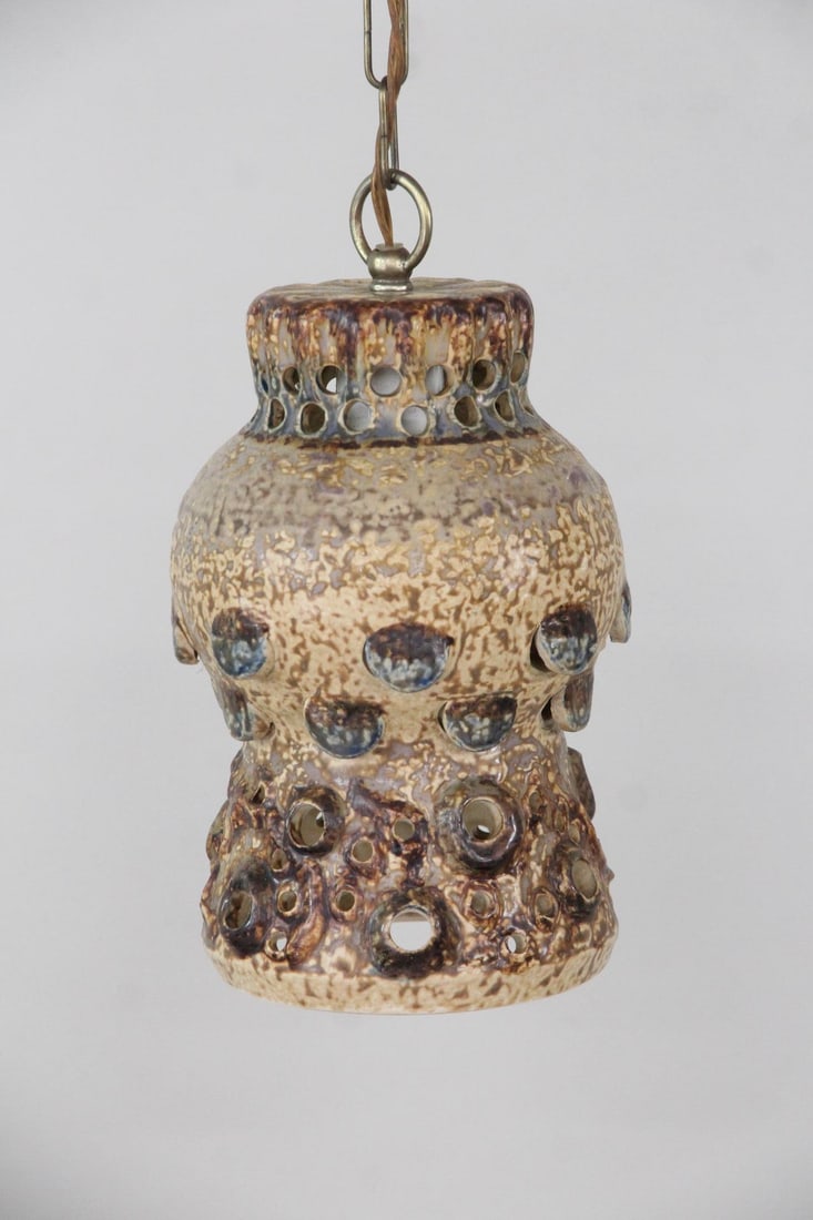 Brutalist Ceramic Pendant Lamp: Danish Mid-Century Modern Brutalist Ceramic Pendant Lamp. A Danish ceramic pendant lamp with a textured, speckled glaze and decorative perforated cutouts. Dimensions are 10.5 in h x 6 in w x 6 in d. C