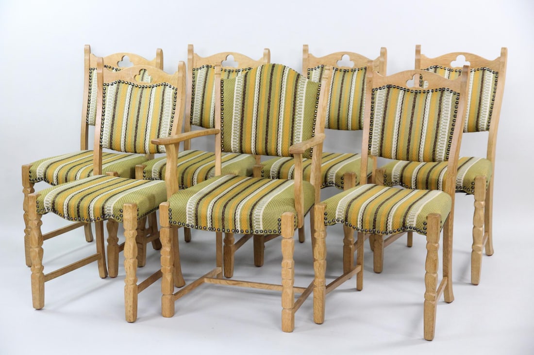 Set of 7 Danish Oak Dining Chairs, Cutout Backs, Henning Kjaernulf: Set of 7 Danish Oak Dining Chairs, Cutout Backs, Henning Kjærnulf. This set of chairs consists of six side chairs and one armchair with light oak frames and carved legs. They have green, white, and