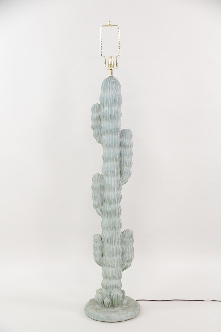 Plaster Saguaro Cactus Floor Lamp: Plaster Saguaro Cactus Floor Lamp. Incredible floor lamp in the form of a saguaro cactus, painted green. Dimensions are 63 in h x 11.5 in w x 11.5 in d. Condition is good with some chips to the