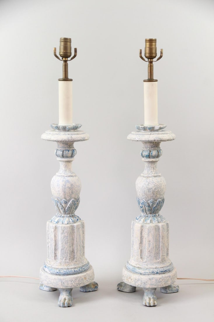 Pair of Neoclassical Lamps with Paw Feet: Pair of Neoclassical Candlestick Lamps with Paw Feet. Matching pair of plaster lamps with blue and white finish. The paw feet add character. Dimensions of the lamp are 29.5 in h x 8 in w x 8 in d.