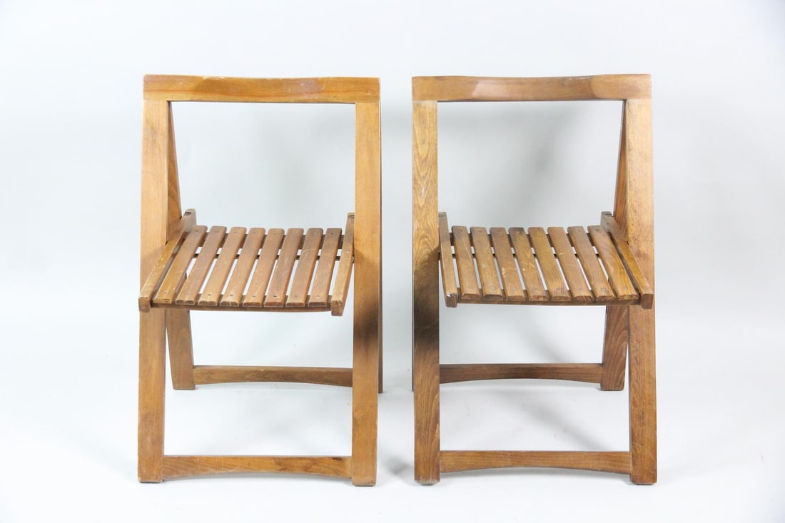 Pair of Aldo Jacober "Trieste" Folding Chairs: Pair of Mid-Century Modern Aldo Jacober "Trieste" Folding Chairs. Matching pair of folding chairs with a distinctive angular wooden design. Marked Made in Romania. Dimensions are 28 in h x 18 in w x 1