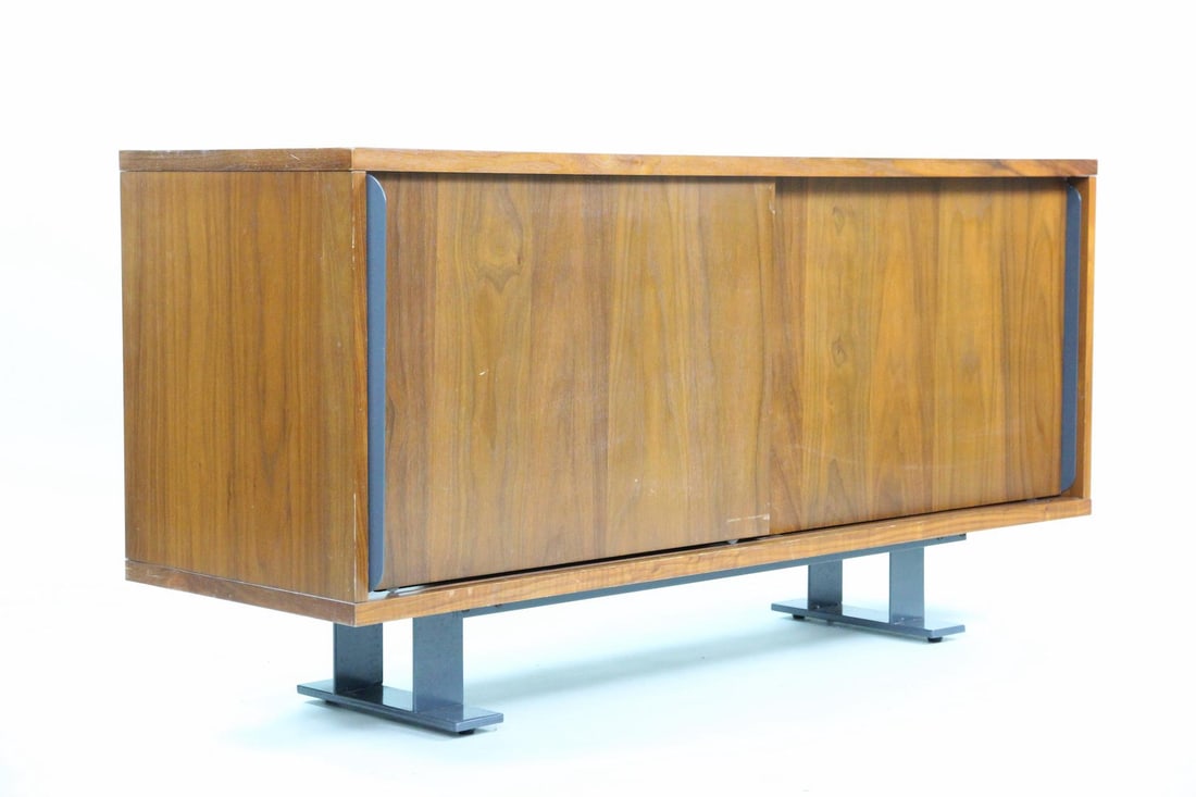 Contemporary Credenza with Iron Beam Legs: Contemporary Credenza Media Cabinet with Iron Beam Legs. Wooden media cabinet has sliding doors and industrial type metal beam legs. Dimensions are 27.5 in h x 54 in w x 18 in d. Condition is fair wit