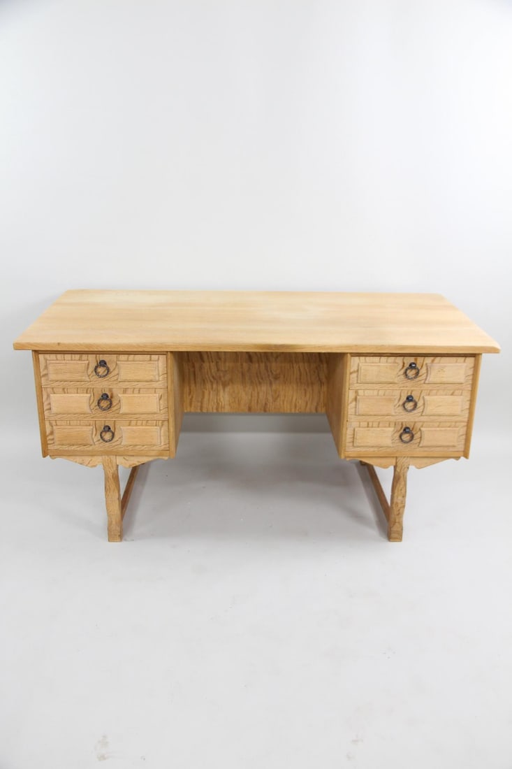 Danish Oak Executive Desk, Iron Hardware, Henning Kjaernulf: Oak Executive Desk, Henning Kjærnulf. This large desk features six front drawers with brass pulls and multiple storage cubbies to the back. Made of light-colored oak with a visible grain. Key