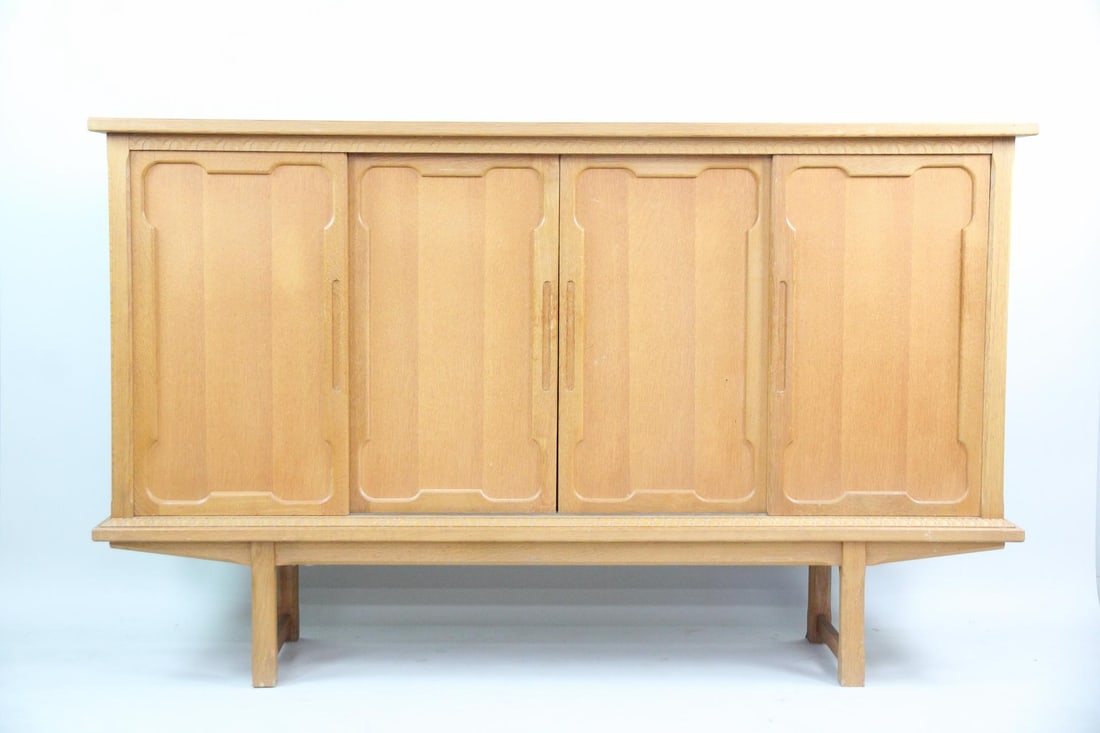 Minimalist Oak Tall Credenza Sideboard: Minimalist Oak Tall Credenza Sideboard. Possibly designed by Henning Kjærnulf. This tall sideboard has sliding doors. Unmarked, we believe this is by Henning Kjærnulf. Key included. Dimensions are