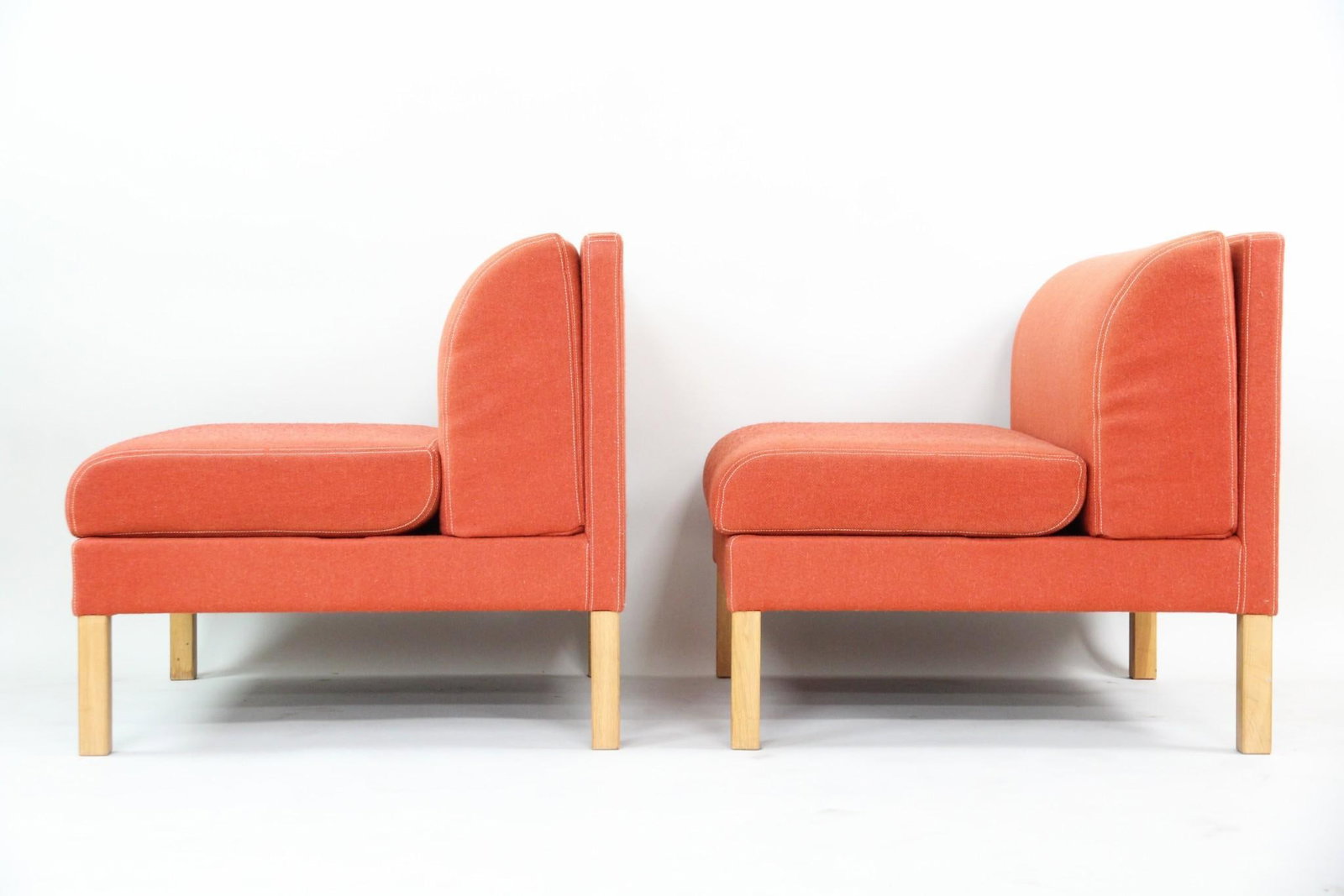 Pair of Modular Wool Lounge Chairs, Bernt Peterson: Pair of Danish Modern Wool Lounge Chairs, Bernt Peterson. Great modular chairs with straight wooden legs can be combined to form a loveseat. Upholstered in a nice burnt orange wool twill fabric. Unmar