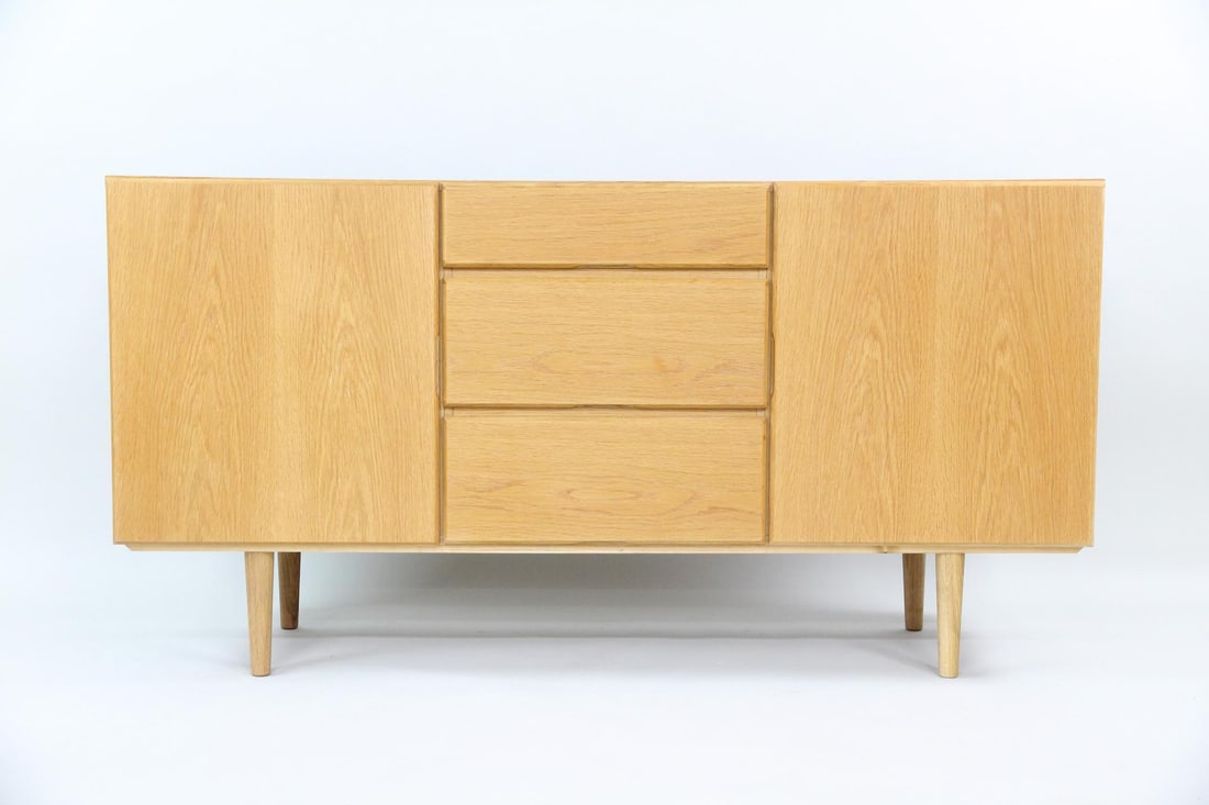 Minimalist Oak Credenza Sideboard: Mid-Century Modern Minimalist Oak Credenza Sideboard. Credenza in light oak, with clean lines and no exterior hardware. Three drawers and 2 cabinets provide lots of storage. Dimensions are 30.5 in h