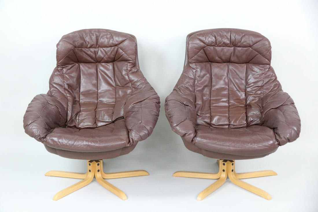 Pair of H.W. Klein Silhouette Brown Leather Lounge Chairs: Pair of Danish Mid-Century Modern H.W. Klein Silhouette Brown Leather Lounge Chairs. Matching pair of "Silhouette" swivel lounge chairs in brown leather upholstery and with light wood five star bases.