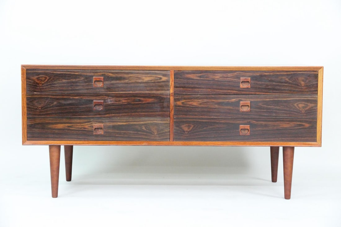 Low Profile Rosewood 6 Drawer Chest, E. Brouer: Danish Mid-Century Modern Low Profile Rosewood 6 Drawer Chest, E. Brouer. Low chest of drawers in rosewood, with recessed carved handles and tapered legs. We believe this cabinet was designed by Erik