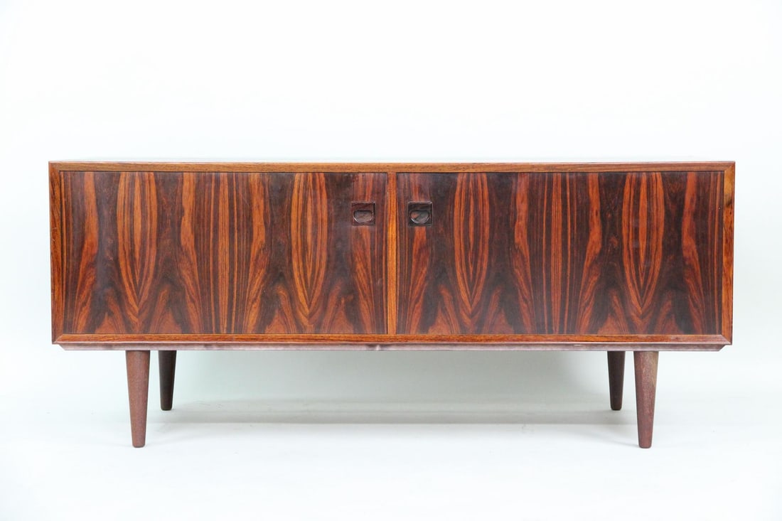 Low Profile Rosewood Cabinet, E. Brouer: Danish Mid-Century Modern Low Profile Rosewood Credenza Cabinet, E. Brouer. Low 2 door cabinet in attractive book matched rosewood, with recessed carved handles and tapered legs. We believe this