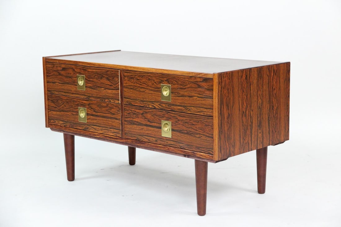 AEJM Møbler Rosewood Cabinet, Brass Pulls: Danish Modern AEJM Mobler Rosewood Chest of Drawers, Brass Pulls. A petite cabinet made of beautifully grained rosewood, with four drawers featuring sculptural brass pulls and tapered legs. Labeled