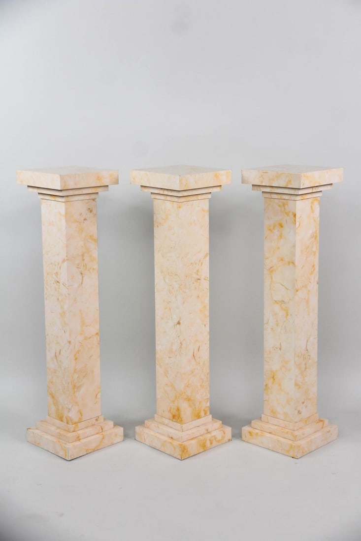 Set of 3 Postmodern Faux Marble Pedestals: Set of 3 Postmodern Faux Marble Display Pedestals, Plant Stands. Three matching column pedestals covered in faux marble formica. Dimensions are 40 in h x 10 in w x 10 in d. Condition is good with