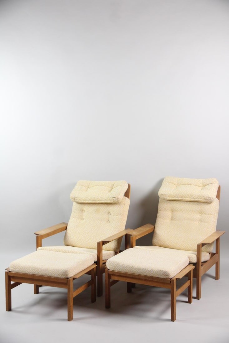 Pair of Teak Lounge Chairs & Ottomans: Pair of Danish Modern Teak Lounge Chairs & Ottomans. Matching pair of adjustable back chairs with teak frames with paddle arms, and pale yellow and white fabric cushions. Matching ottomans included. D