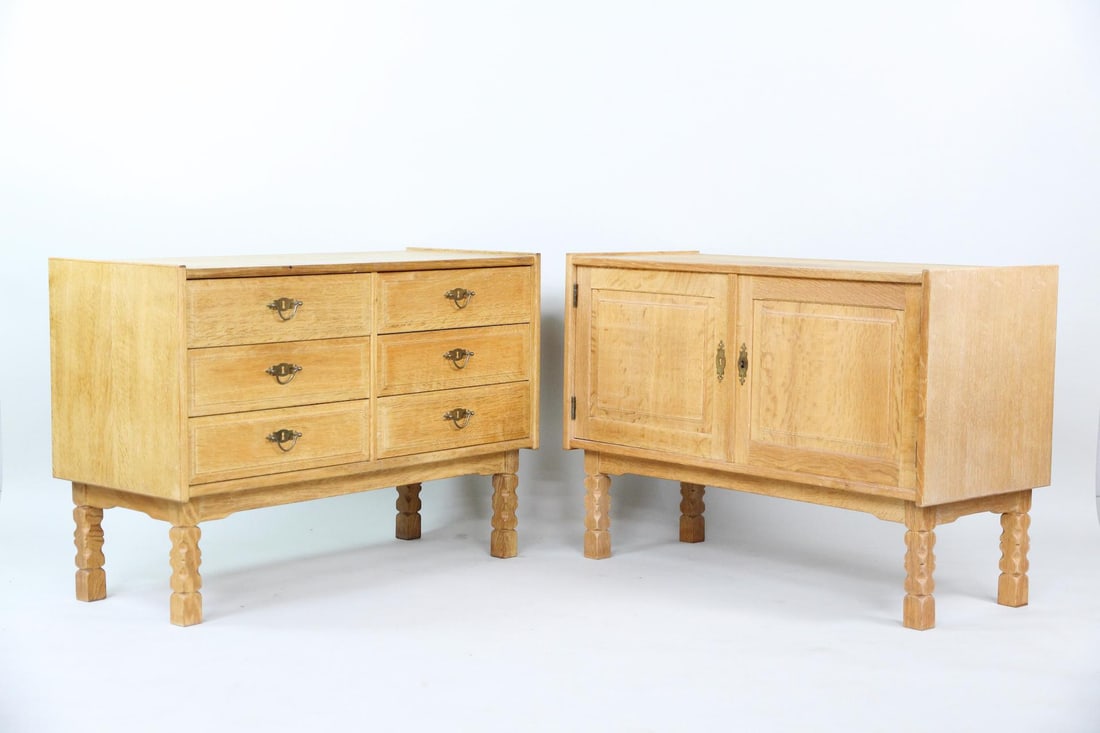 Pair of Low Oak Bedside Cabinets, Henning Kjaernulf: Mid Century Modern Pair of Low Oak Bedside Cabinets, Bedside Tables, Henning Kjærnulf. A pair of solid oak cabinets with brass hardware, and thick carved legs. One has two doors with interior