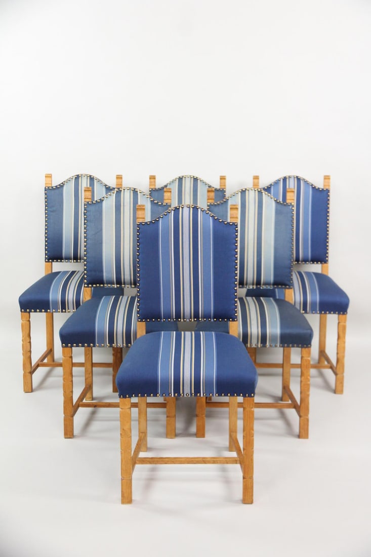 Set of 6 Rustic Blue Upholstered Dining Chairs, Henning Kjaernulf: Set of 6 Danish Modern Oak Dining Chairs, Henning Kjærnulf. Matching chairs with carved oak frames and blue striped upholstery. Unmarked, we believe these are by Henning Kjærnulf. Dimensions are 37.