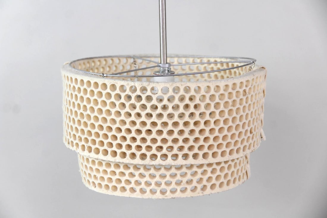 Honeycomb Pendant Lamp: Postmodern Two Tier Honeycomb Pendant Lamp. Hanging light with a two tier foam shade pierced like a honeycomb. Dimensions are 21.5 in h x 13.5 in w x 13.5 in d. Condition is fair with staining and wea