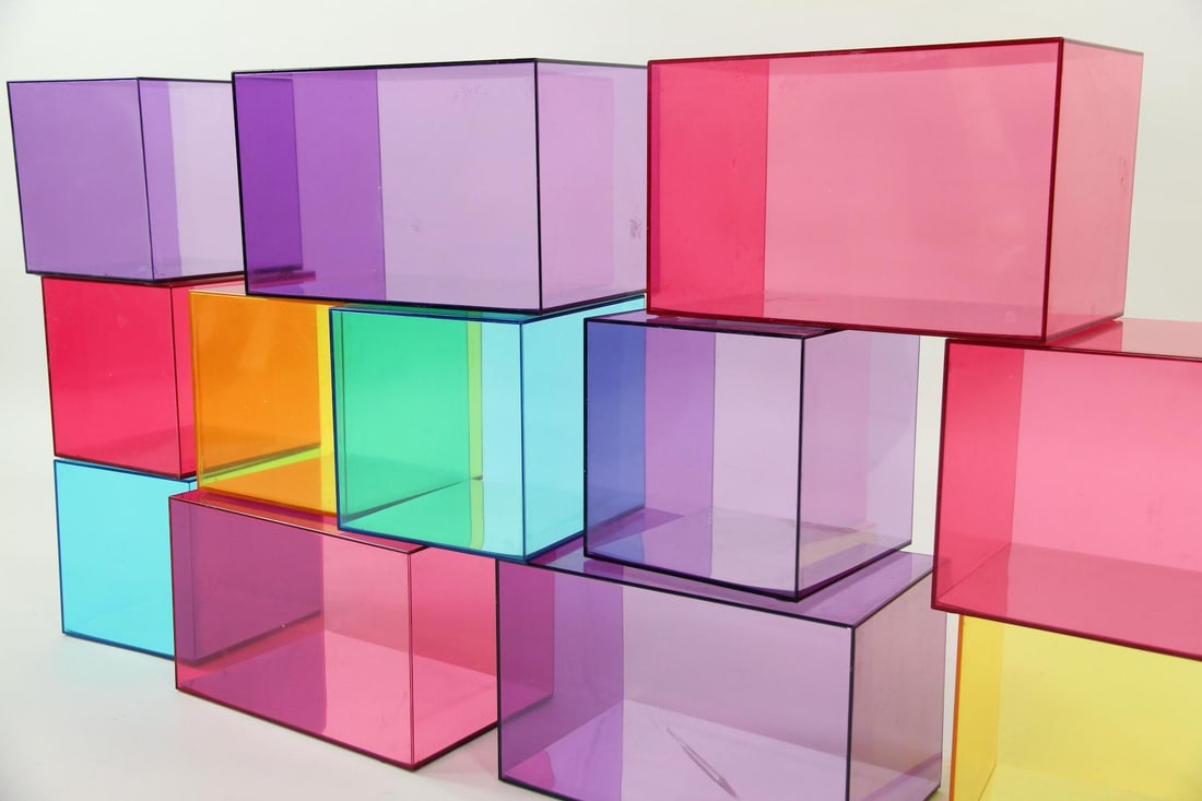 Set of 12 Colorful Translucent Modular Storage Cubes: Set of 12 Colorful Translucent Modular Storage Cubbies. In vibrant pink, purple, blue and yellow, set of translucent cubbies can be stacked in a variety of ways. Includes 4 rectangular units and 8