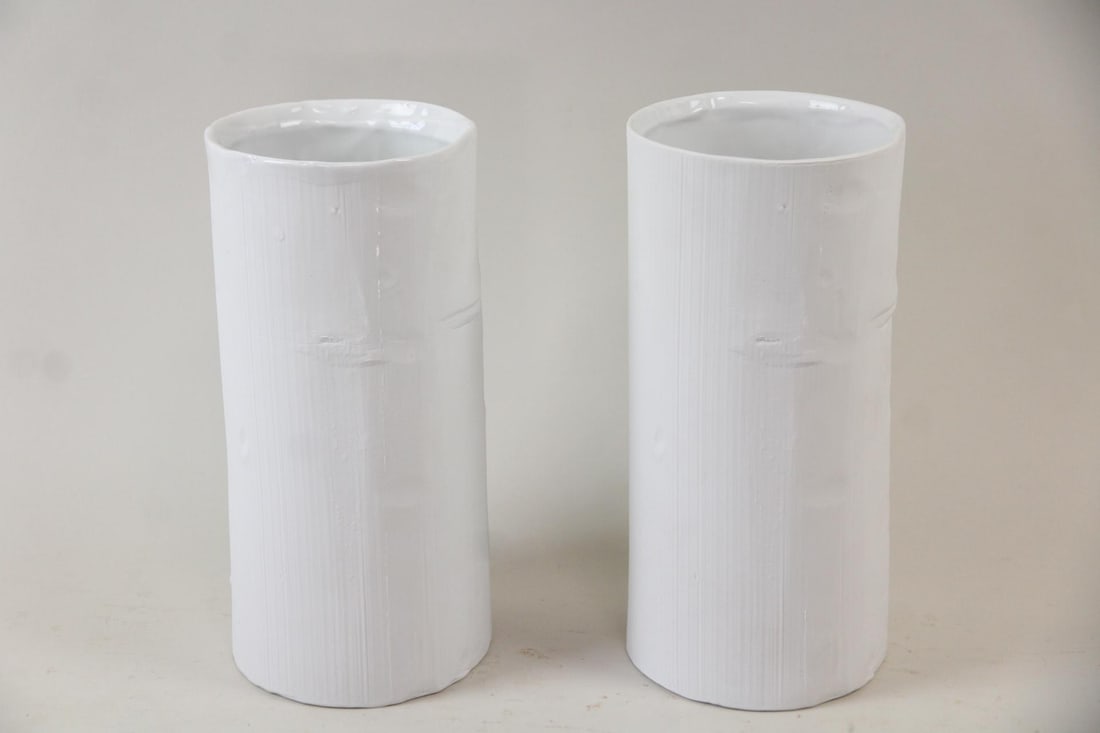Pair of Arnie Zimmerman Minimalist Porcelain Vases: Pair of Arnie Zimmerman Minimalist Porcelain Vases. Two cylindrical white porcelain vases, glazed on the interior and impressed with numbers, likely the date of manufacture (240614) on the back.