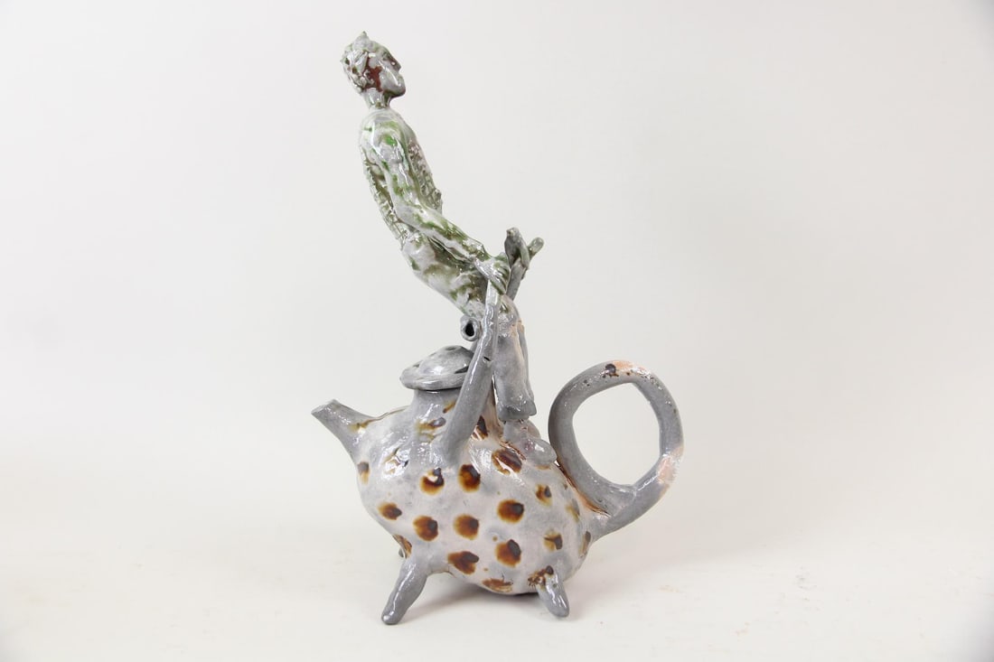 Arnie Zimmerman Figural Sculptural Teapot, 2012: Arnie (Arnold) Zimmerman Figural Sculptural Teapot, 2012. An untitled stoneware sculptural teapot depicting a man riding a mythical creature. Signed and dated by the artist Arnie Zimmerman (American,