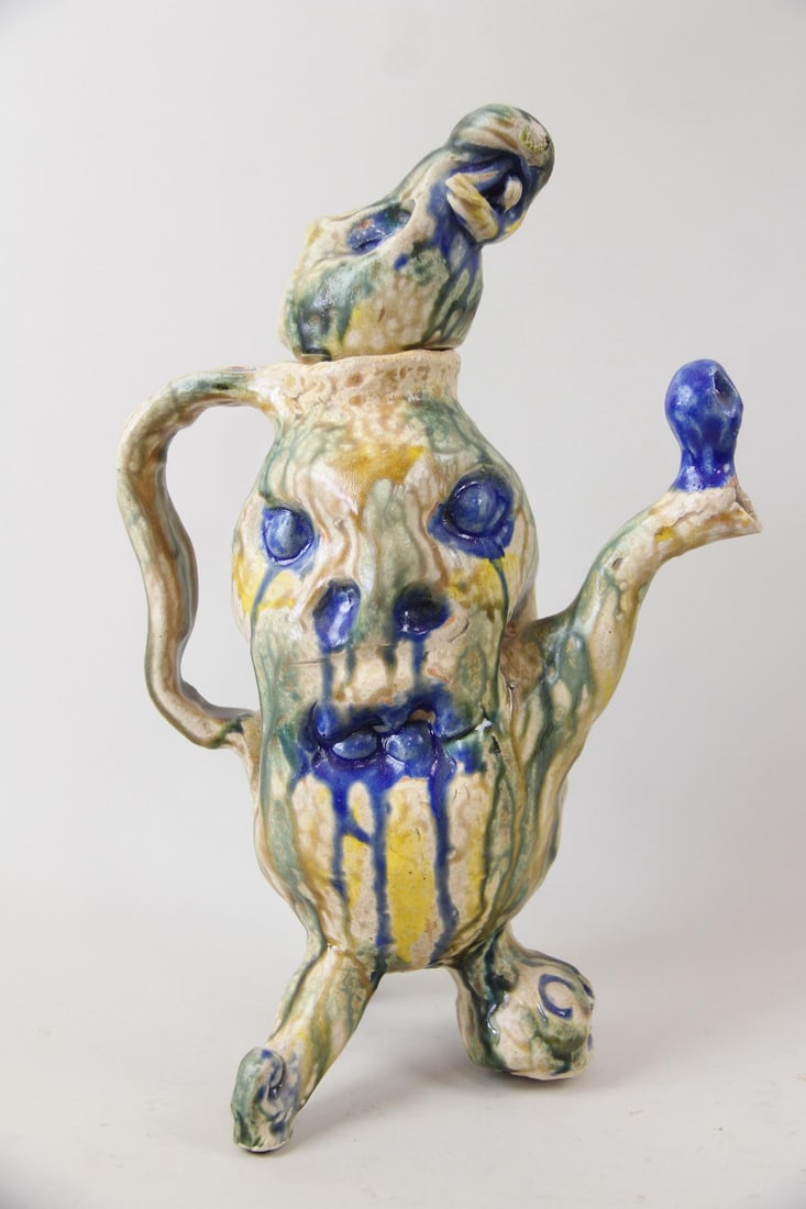 Arnie Zimmerman "Three-legged Face" Sculptural Teapot, 1999: Arnie (Arnold) Zimmerman Three-legged Face Sculptural Teapot, 1999. A stoneware sculptural teapot titled "Three-legged Face." Signed by the artist Arnie Zimmerman (American, 1954-2021). Dimensions
