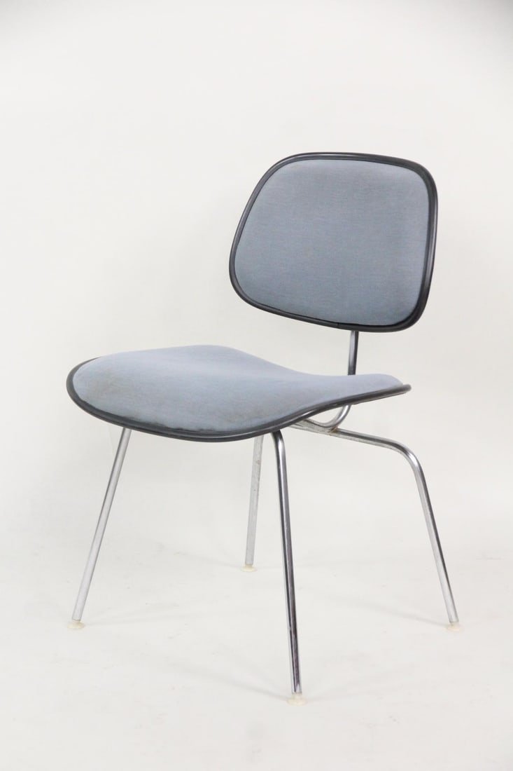 Eames for Herman Miller DCMU Chair, Blue: Eames for Herman Miller DCMU Chair, Blue. Iconic chair in molded black plastic composite with light blue upholstery and tubular steel frame. Marked with Eames, Herman Miller logo and label. Dimensions
