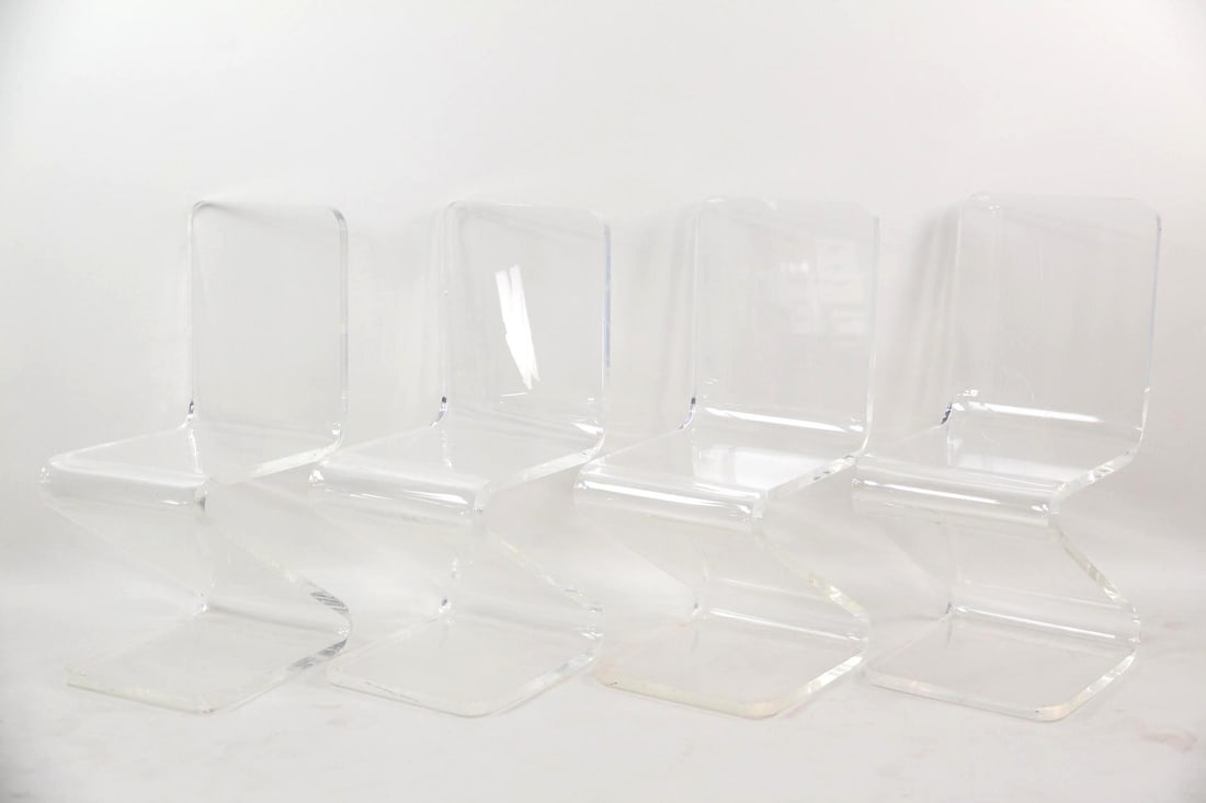 Set of 4 Lucite "Z" Zigzag Chairs: Set of Modern 4 Lucite "Z" Zigzag Chairs. Set of chairs, each is made of a single piece of clear lucite or acrylic, with rounded corners Dimensions are 34.5 in h x 15.5 in w x 17.5 in d. Condition is 