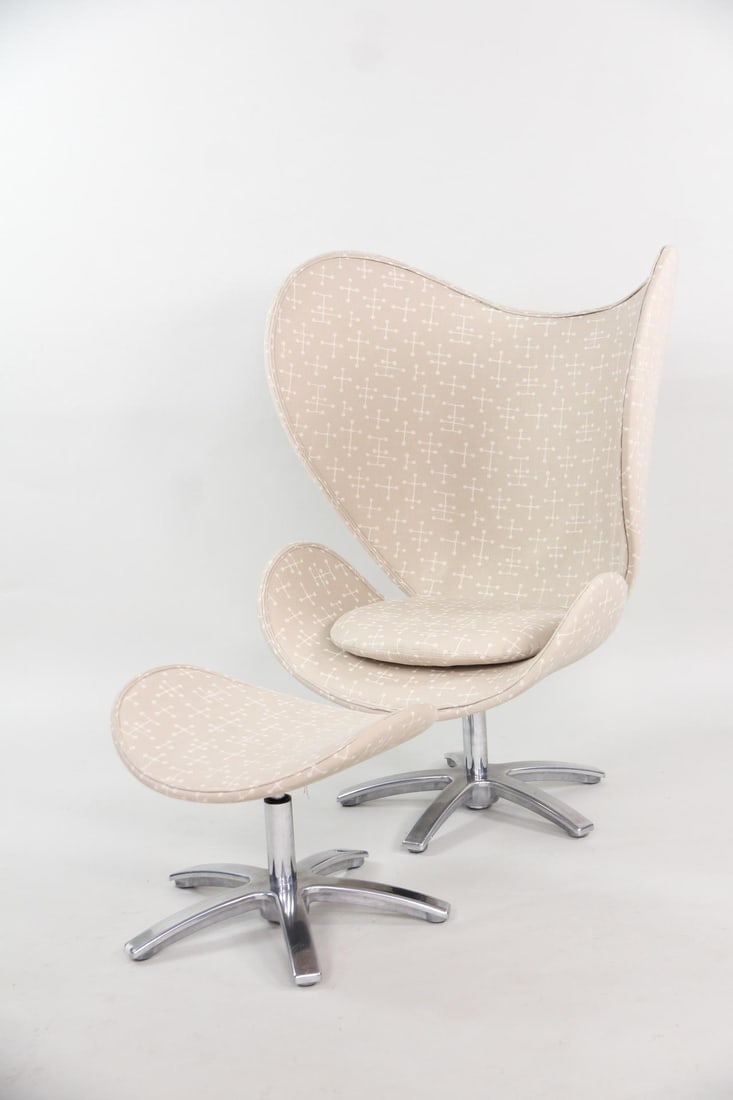 Contemporary Egg Lounge Chair & Ottoman, Maharam Dot Pattern by Eames: Contemporary Egg Style Lounge Chair & Ottoman style of Arne Jacobsen. A wing-shaped swivel chair and matching curved ottoman with metal star bases, upholstered in a light beige patterned fabric, Mahar