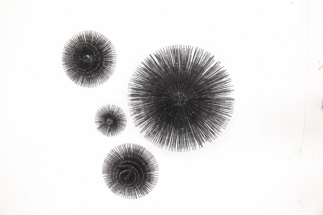 Set of 4 Brutalist Sunburst Wall Art Sculptures: Set of 4 Brutalist Sunburst Wall Art Sculptures. A set of wall sculptures with starburst or sea urchin-like forms in four different sizes. Made of metal with gold painted tops. These are contemporary 