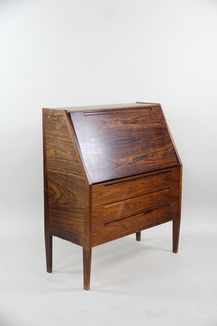 Rosewood Slant Secretary Desk, Kai Kristiansen: Mid-century Modern Rosewood Slant Secretary Desk, Kai Kristiansen. This secretary desk is made from richly grained Brazilian rosewood and features an angled drop-front writing surface above three draw
