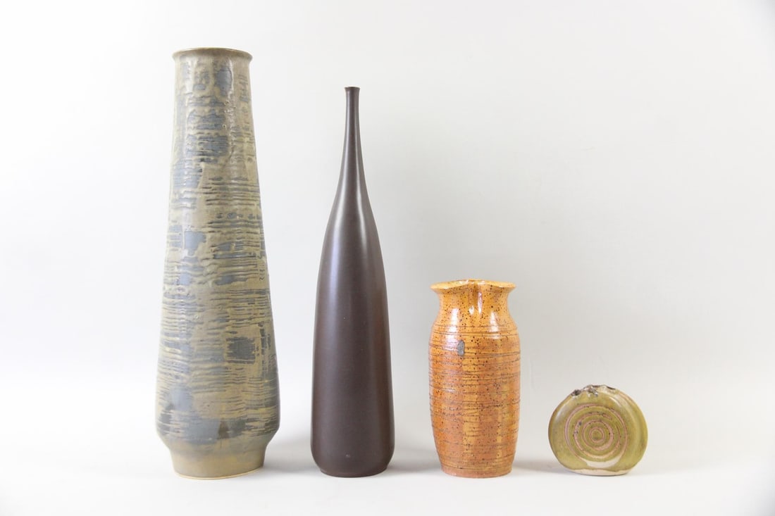 Group of 4 Studio Pottery Vases, incl. Jack Squire for Howat Kilns: Group of 4 Mid-Century Modern Studio Pottery Vases, incl. Jack Squire for Howat Kilns. Includes a tall blue-grey textured vase, a slender matte brown vase, a mottled orange vase, and a small, squat gr