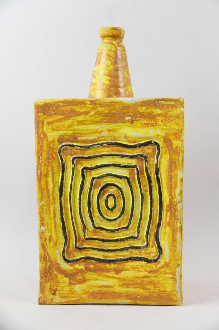 Large Brutalist Yellow Studio Pottery Vase, Signed Ora: Large Brutalist Studio Pottery Vase, Signed Ora. Unusual bottle form vase in bold yellow with contrasting black concentric line work. Signed Ora. Dimensions are 20 in h x 10 in w x 6 in d. Condition