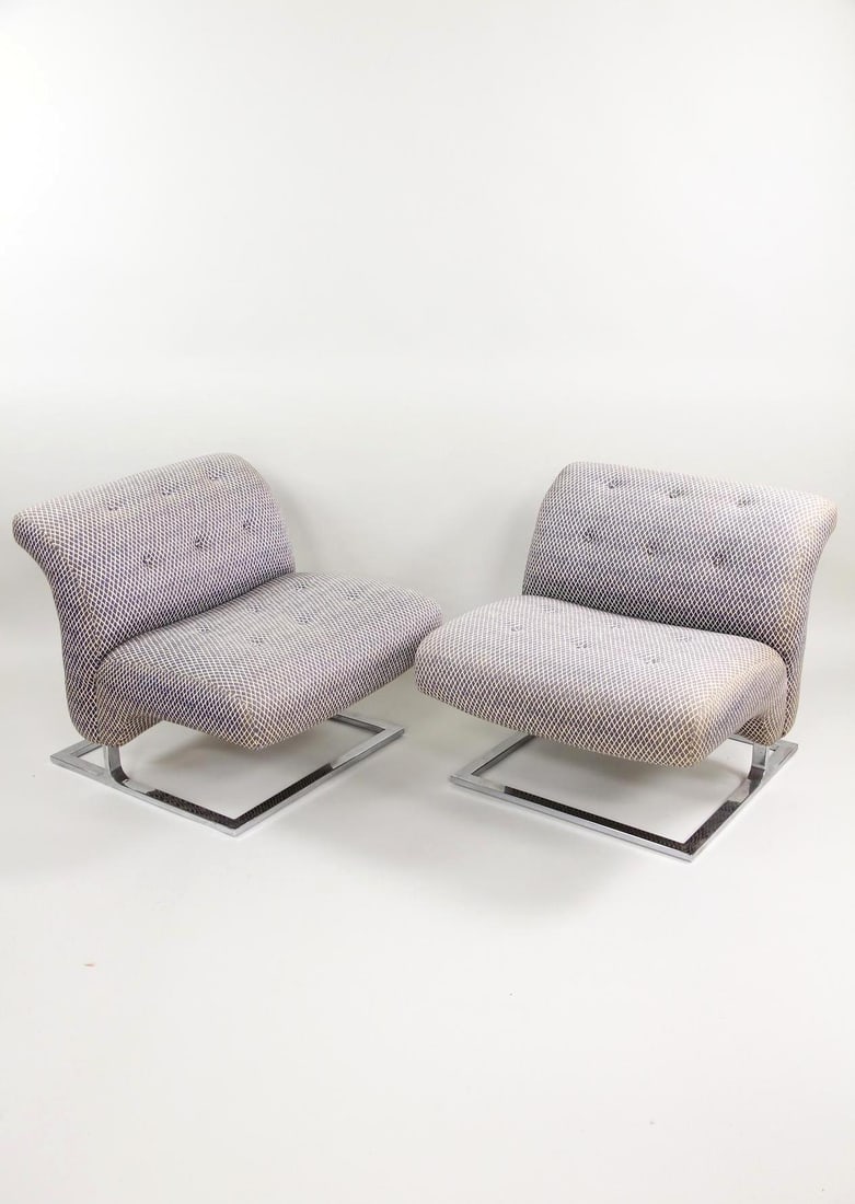 Pair of Chrome Lounge Chairs for Craft Associates, Wave Style: Pair of Chrome Lounge Chairs for Craft Associates, Wave Style. A great pair of cantilever lounge chairs with chrome-plated bases and distinctive wave-like silhouette. Upholstered in a blue & yellow la