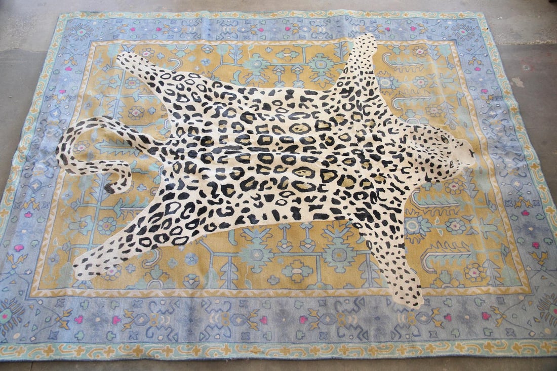 Anthropologie Octavia Leopard Rug, 9 x 12 Ft: Contemporary Anthropologie Octavia Leopard Rug, 9 x 12 Ft. Area rug featuring a white leopard pelt motif over an ornate, blue & gold border. Made of wool & viscose. Labeled Anthropologie to the back c