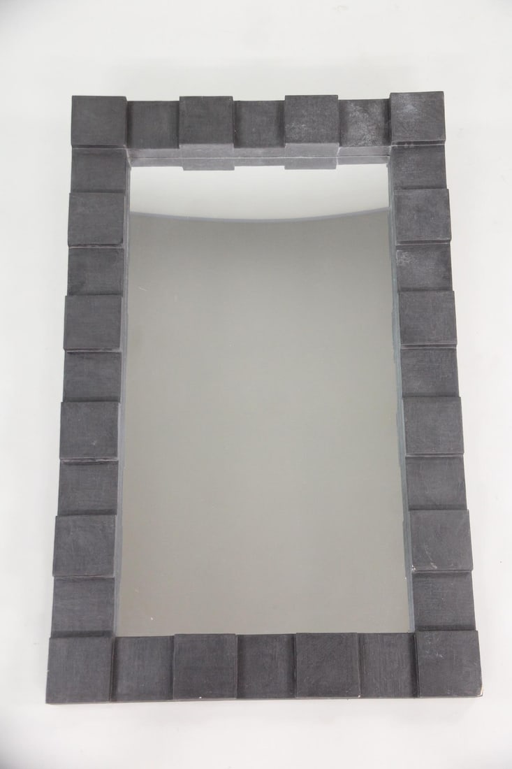 Black Cubist Stepped Block Edge Mirror: Mid-Century Modern Geometric Black Block Mirror. Unusual large rectangular mirror with a frame made from black square styrofoam blocks. Dimensions are 66 in h x 42 in w x 3.75 in d. Condition is good