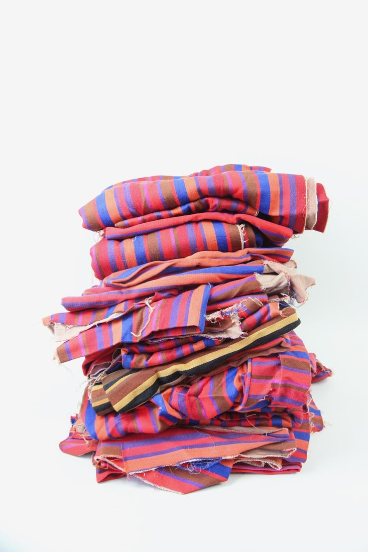 Large 23-Piece Lot of Alexander Girard Fabric: Large 23-Piece Lot of Mid-century Modern Alexander Girard Fabric. A great assortment of Girard fabric pieces in various sizes. Most are striped in tones of fuschia, red, blue, and orange. Dimensions