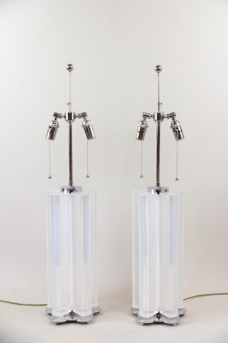 Pair of Lucite & Chrome Lamps: Pair of Mid-Century Modern Lucite & Chrome Lamps. Matching pair of tall lamps with sculptural, transparent Lucite bodies and polished chrome base and fittings. Dimensions are 32.25 in h x 7.5 in w x 7